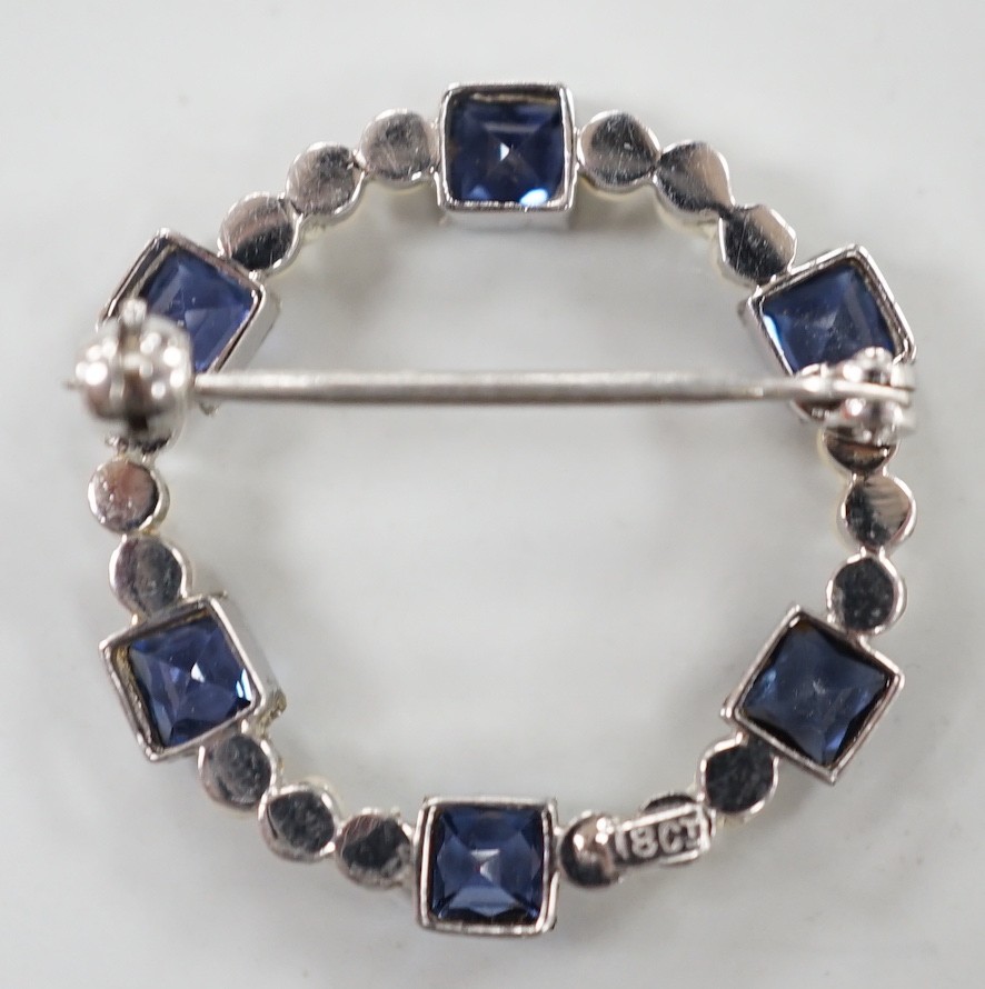 An 18k white metal, synthetic blue spinel? and seed pearl set openwork brooch, 24mm, gross weight 3 grams.